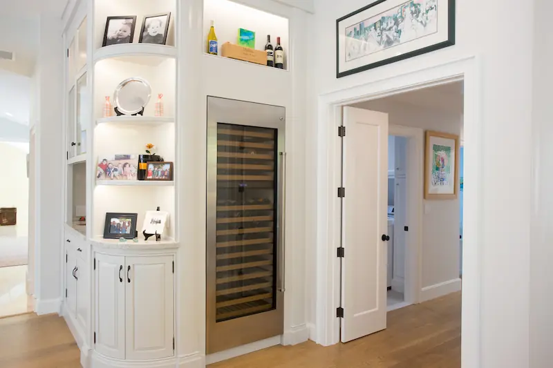Large Sub Zero wine fridge in built-in dining room cabinetry from the Big Canyon Remodel project. Photo by Chris Darnall.