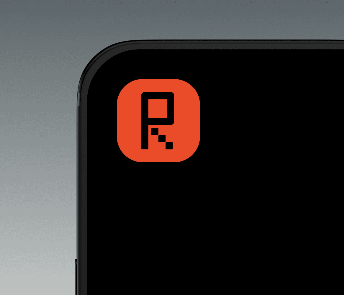 Close-up of a minimalist tech accessory with a bold red "R" logo