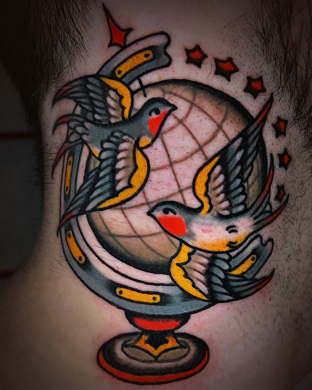 american traditional tattoo of birds and a globe by Hannah Anderson