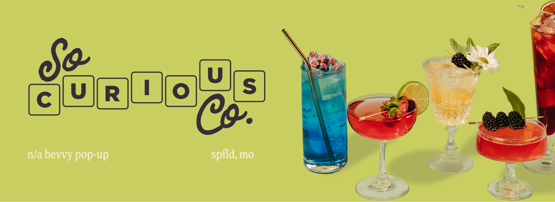 Commercial photography of So Curious Co's mocktails alongside their logo