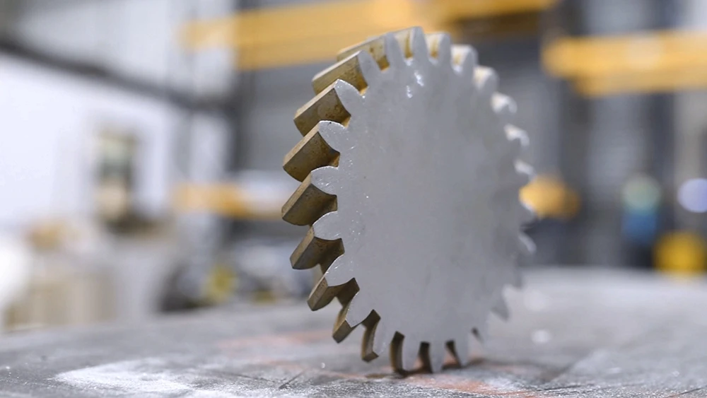 Precision-cut metal gear profile produced using industrial waterjet cutting.