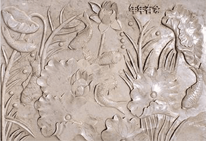 Detailed floral design engraved on stone, demonstrating the Engraving Machine's precision and artistry in crafting beautiful motifs.