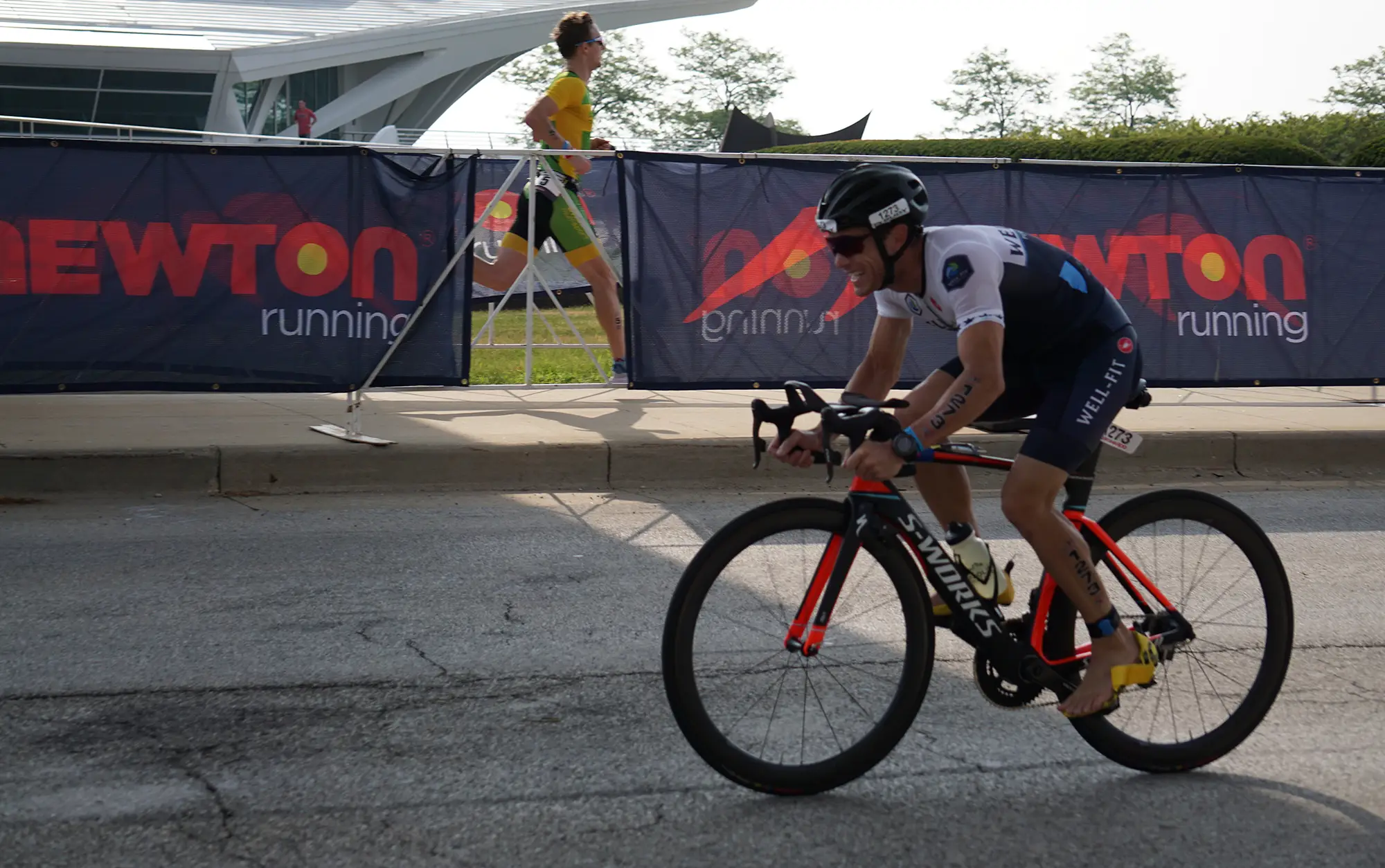Well-Fit triathlon athlete on a Specialized S-Works race bike during the bike leg of a triathlon, coached online by Sharone Aharon