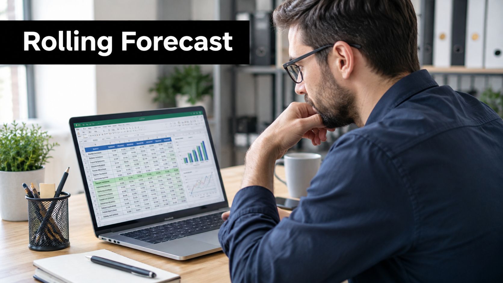 A professional man reviewing financial data and spreadsheet charts on his laptop in a modern home office.
