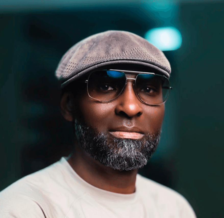 A woman smiling while working at a computer