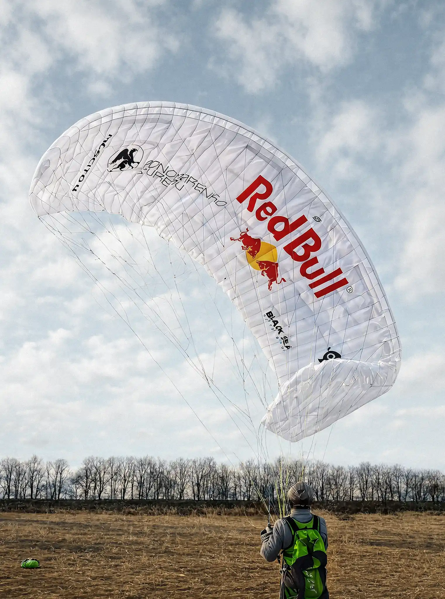 "A finished parachute canopy with a custom graphic layout and my logo placed among the printed marks. This was a small personal project made for a friend, and the canopy is still in use."