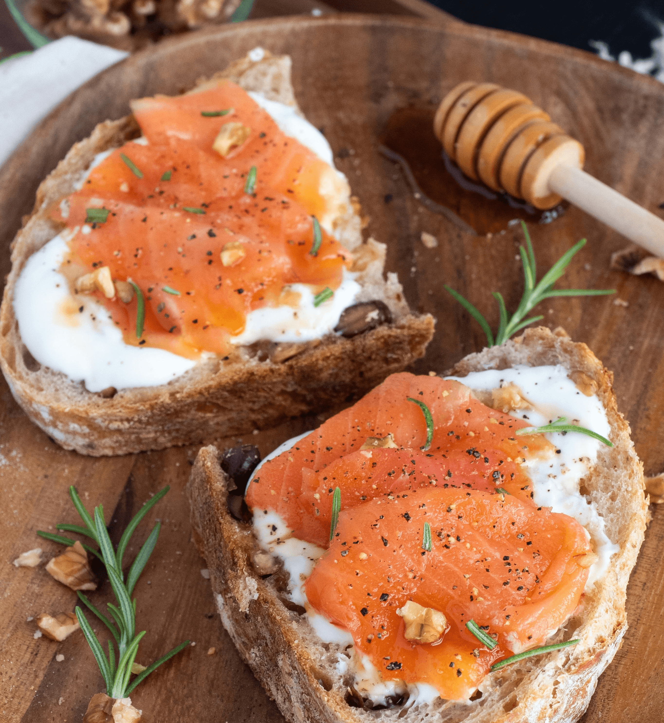 sliced bread with sliced tomato on brown wooden chopping board