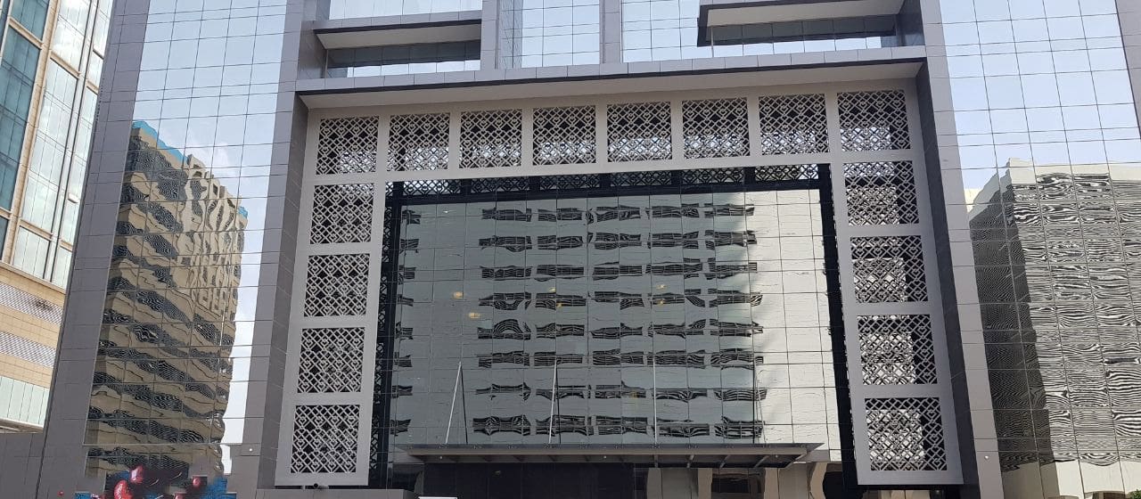 Elegant entrance and ground floor detail of Duja Tower featuring intricate geometric design patterns.