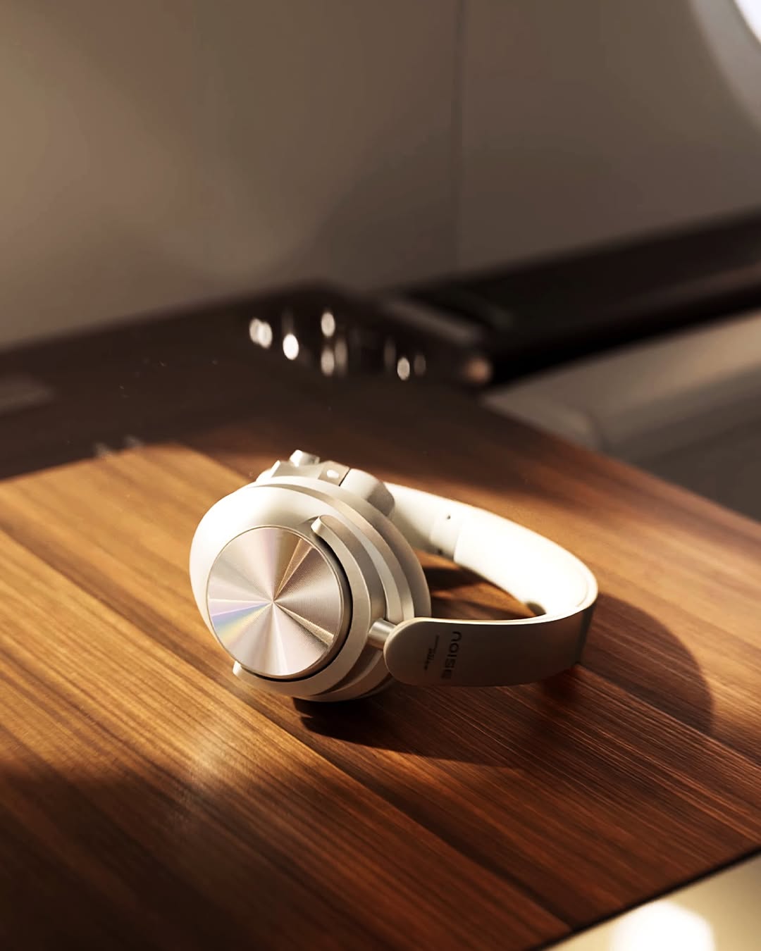 Laptop displaying website on wooden table