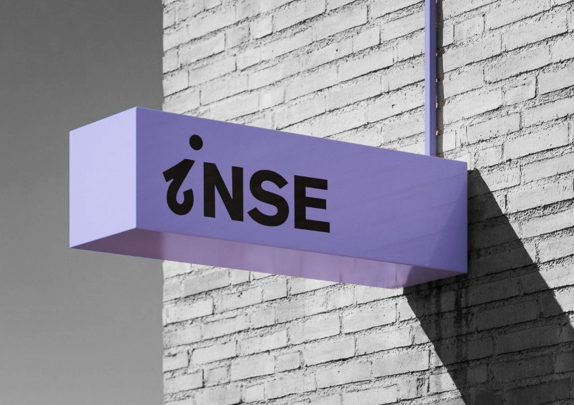 a man in a yellow shirt is on a red track