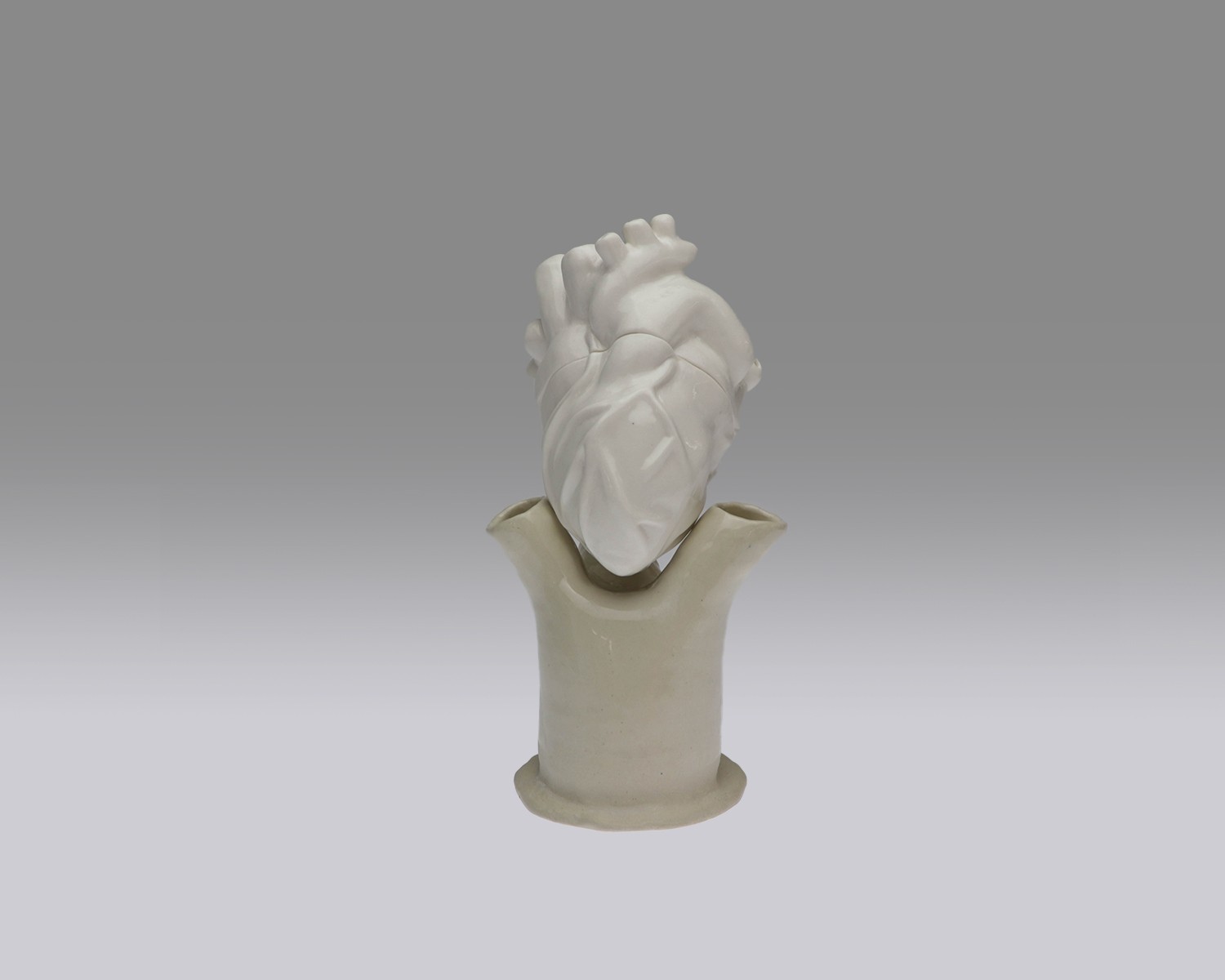 Individual view of a unique ceramic heart from Perfect Imperfection series by Yuxin Song. Highlighting cracks with cubic zirconia and mica powder. Light-up sculpture made with resin, 2022.