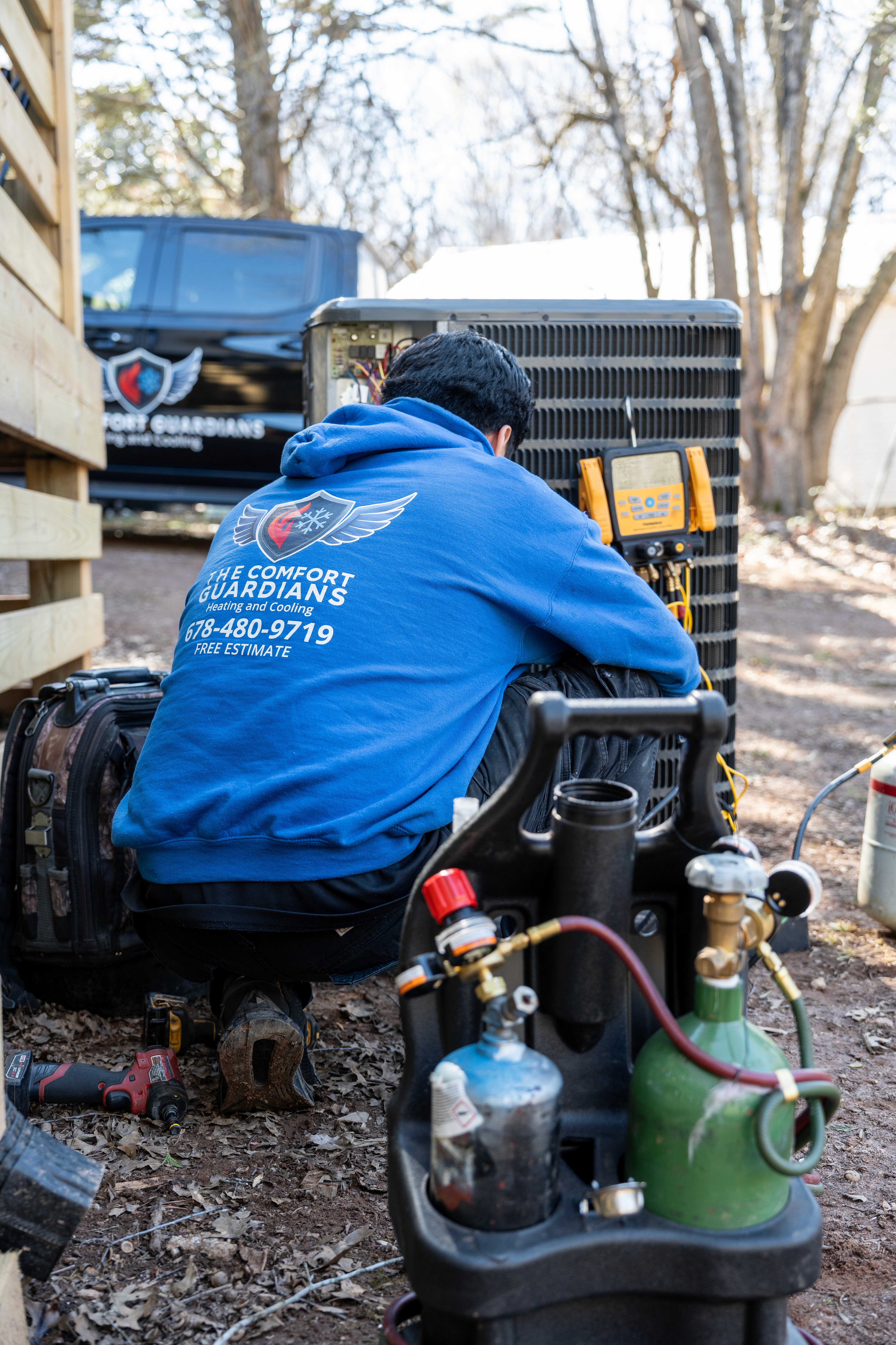 Father and son watching television together on couch.
