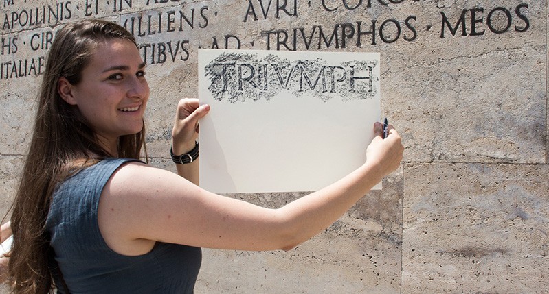 woman holding paper and pencil