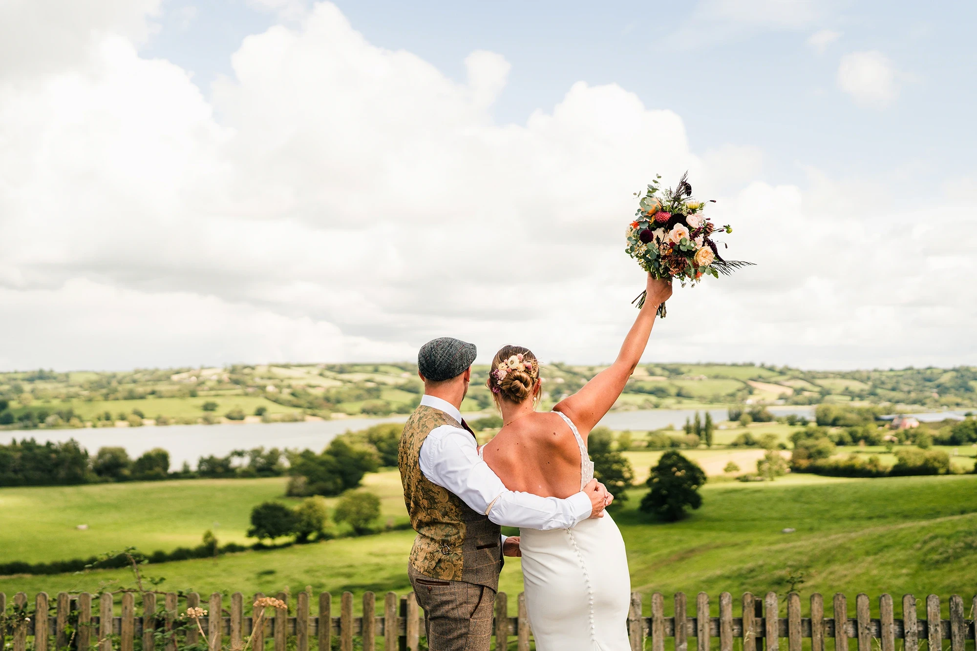 couple posing with flowers