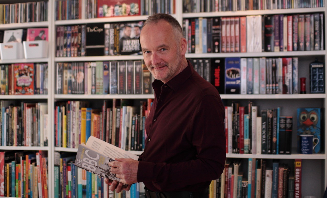 Patrick Bremmer in front of book case