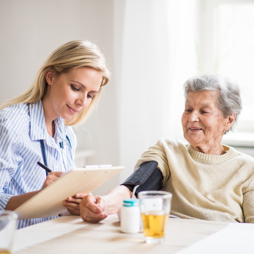 Doctor sitting with patient at table.