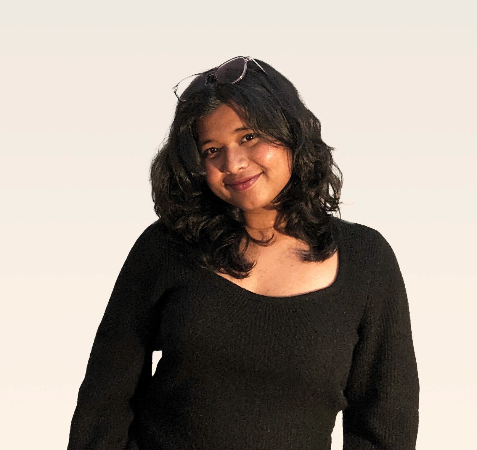Profile portrait of a man in a white shirt against a light background
