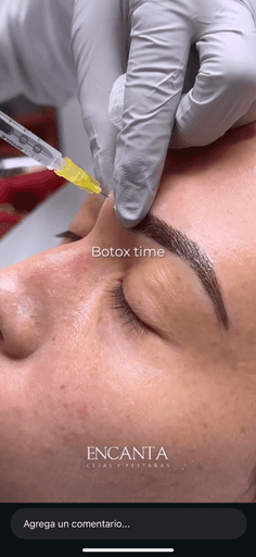 person wearing black watch holding black camera