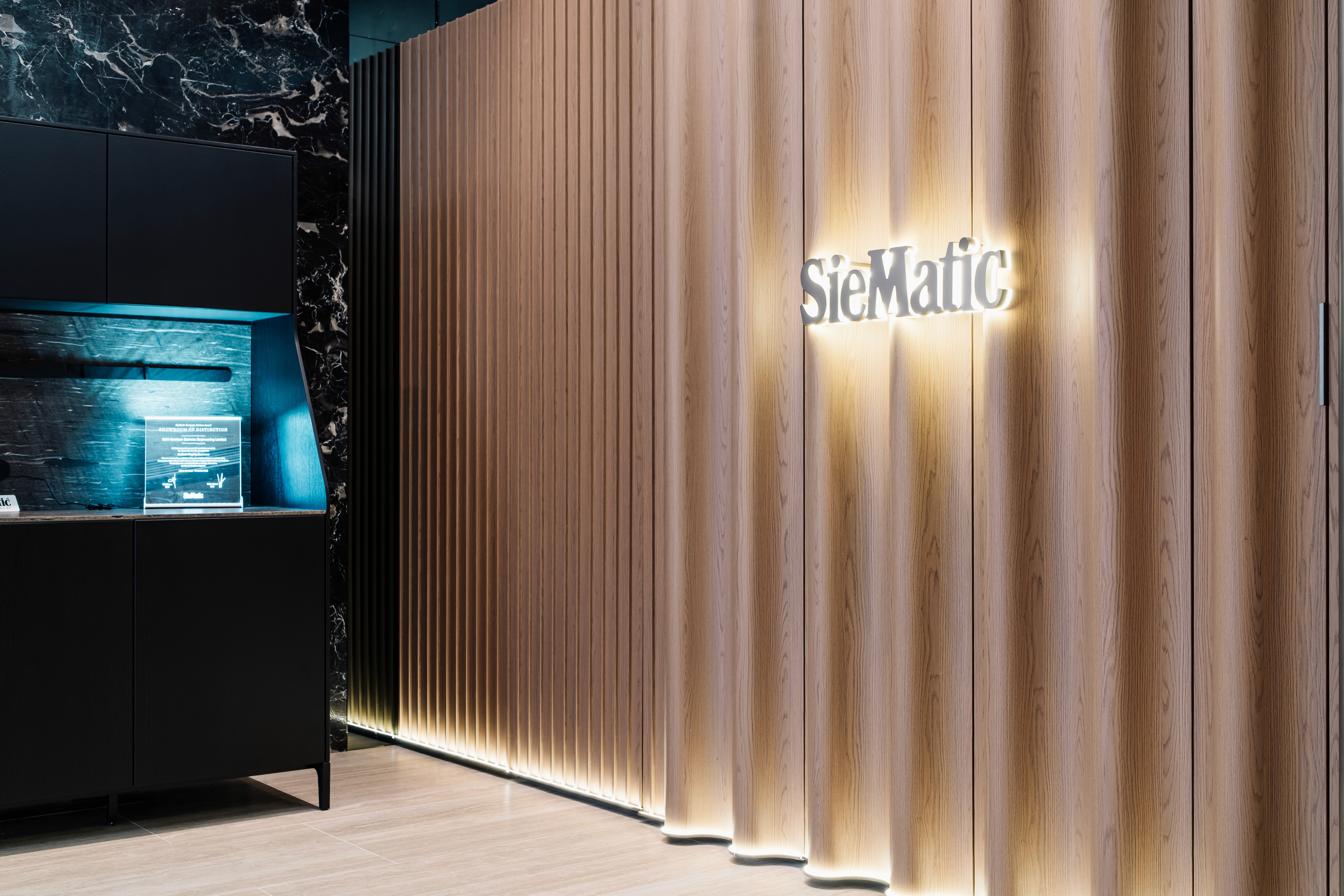 Blurred portrait of a woman with warm skin tones and a purple background.