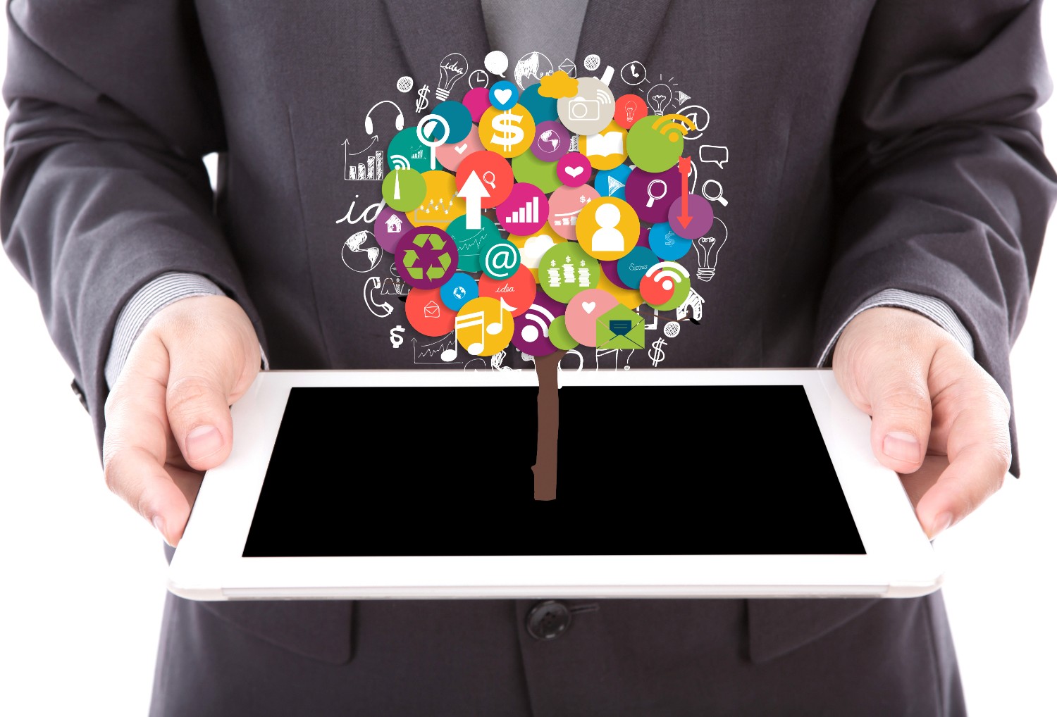 1. A businessman holds a tablet displaying a tree of social media icons, symbolizing digital connectivity and networking.