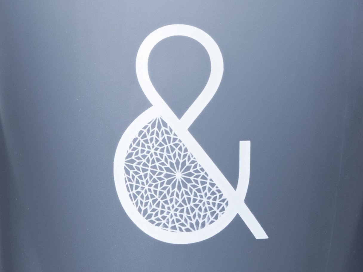 Rustic cabin in a golden field at sunset