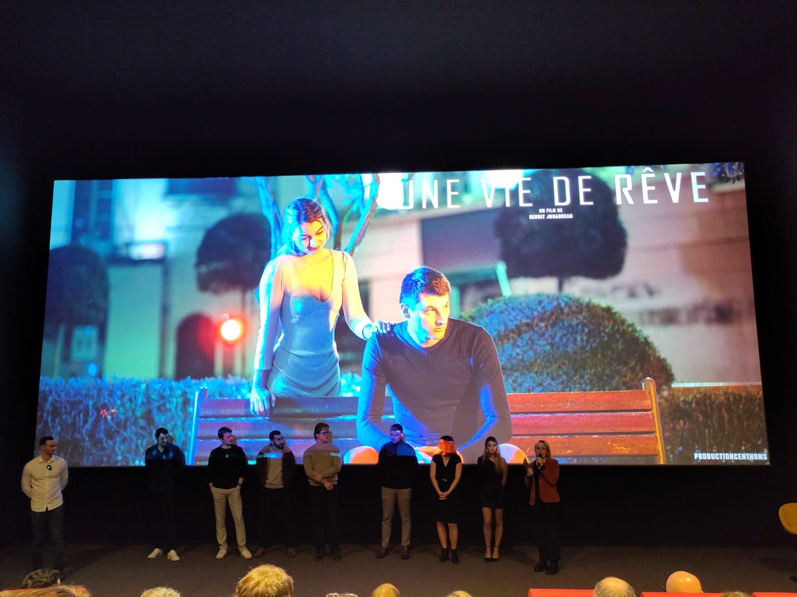 a woman holding a red flower