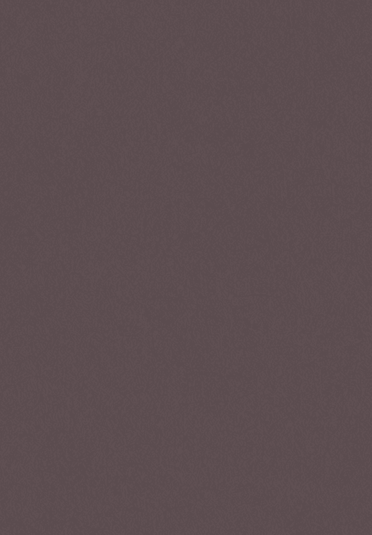 A woman in a straw hat stands in the grass