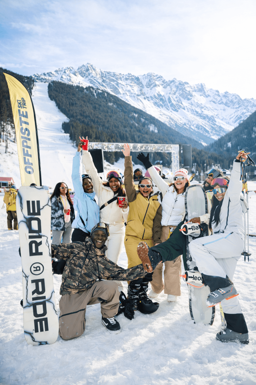 Couple sitting with hot air balloons at sunset