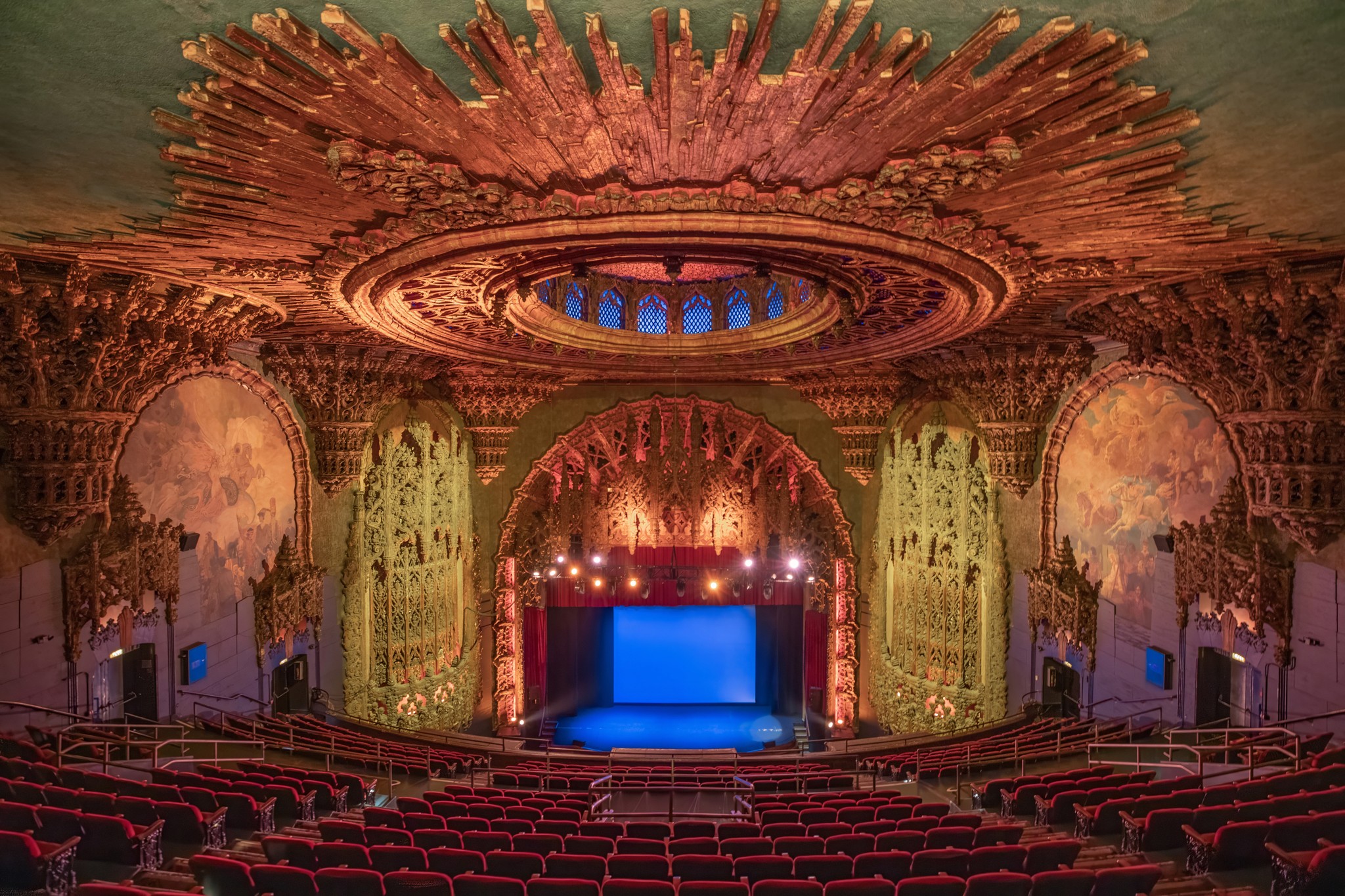 Interior shot of The United Theater featuring theatre seating and ornate roof