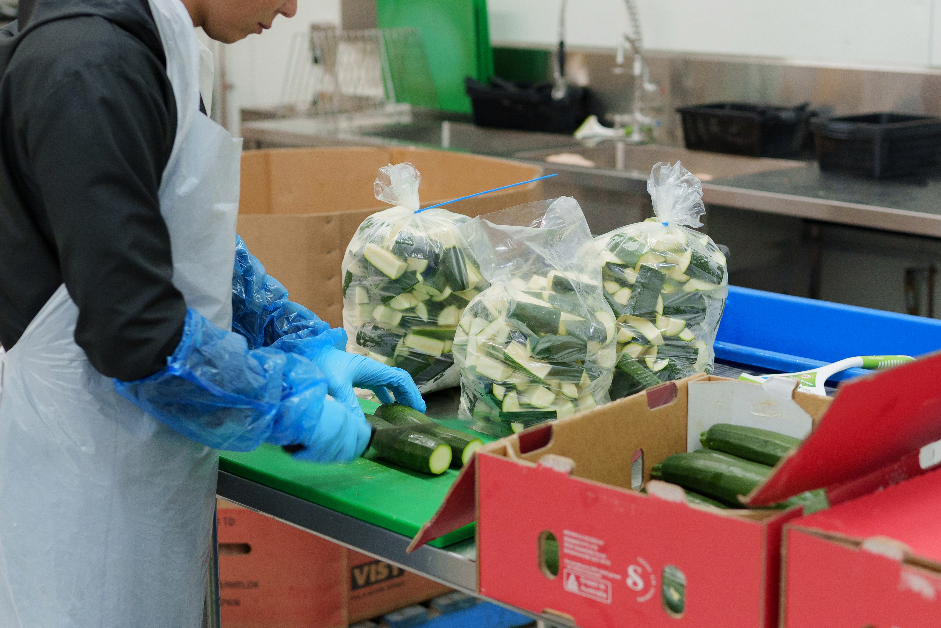 Delivery Woman holding package and smiling to the camera