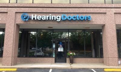 Exterior of a storefront with the sign "Treasury Solutions" prominently displayed above large windows.