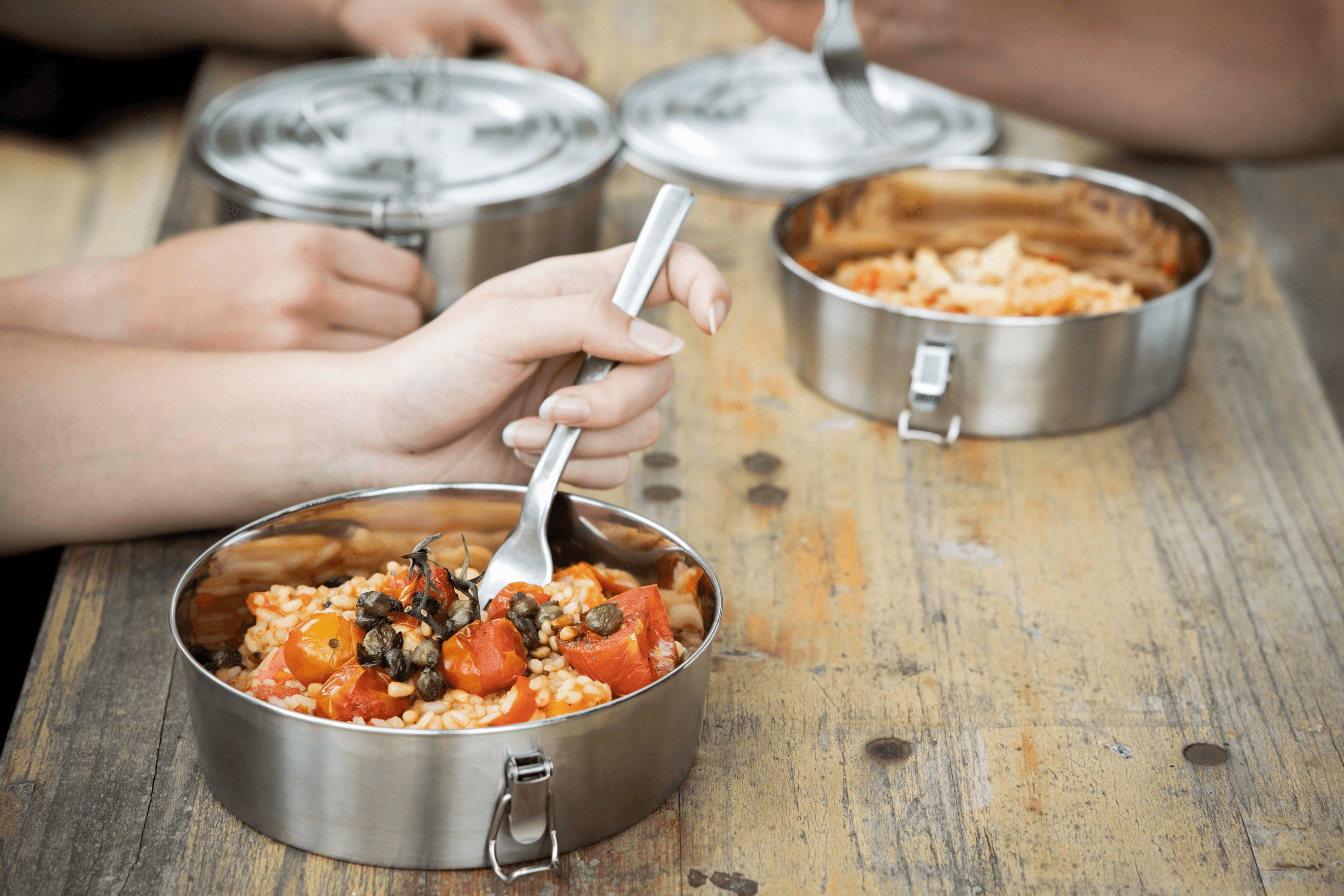 Rice with tomatoes and capers in a metal bowl