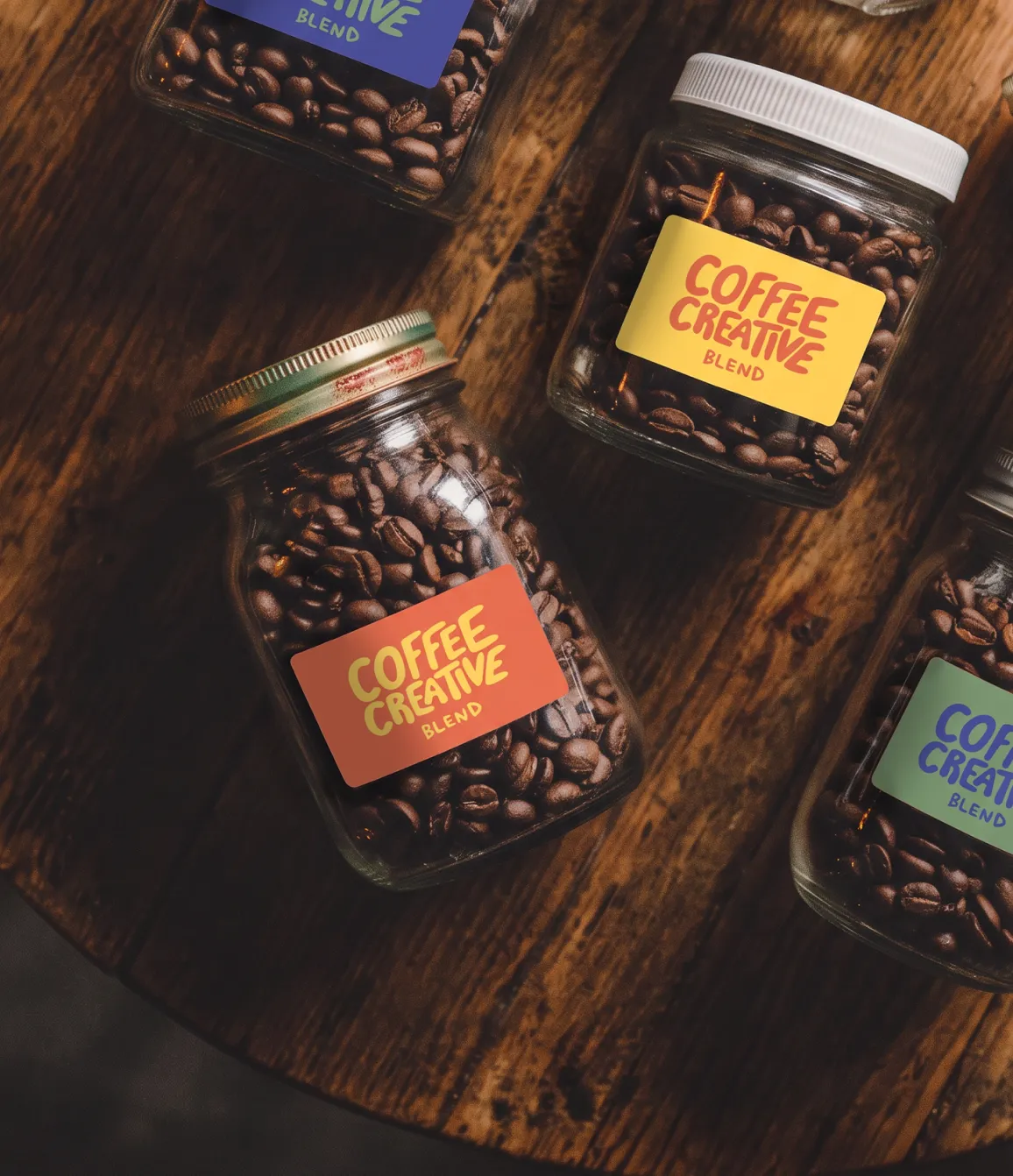 Coffee Creative logo label design on a set of coffee bean jars