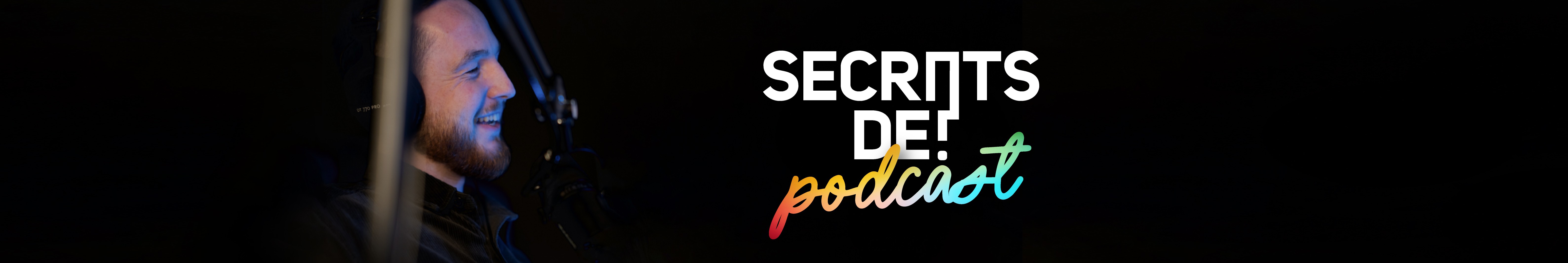 Modern home office setup with a monitor, ergonomic chair, keyboard, and indoor plants near a window with blinds.