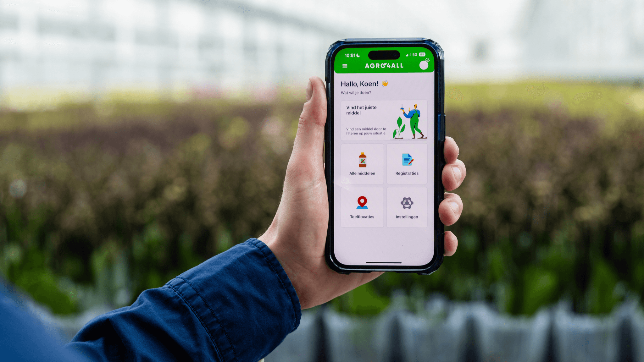 Person using the Agro4All app inside a greenhouse