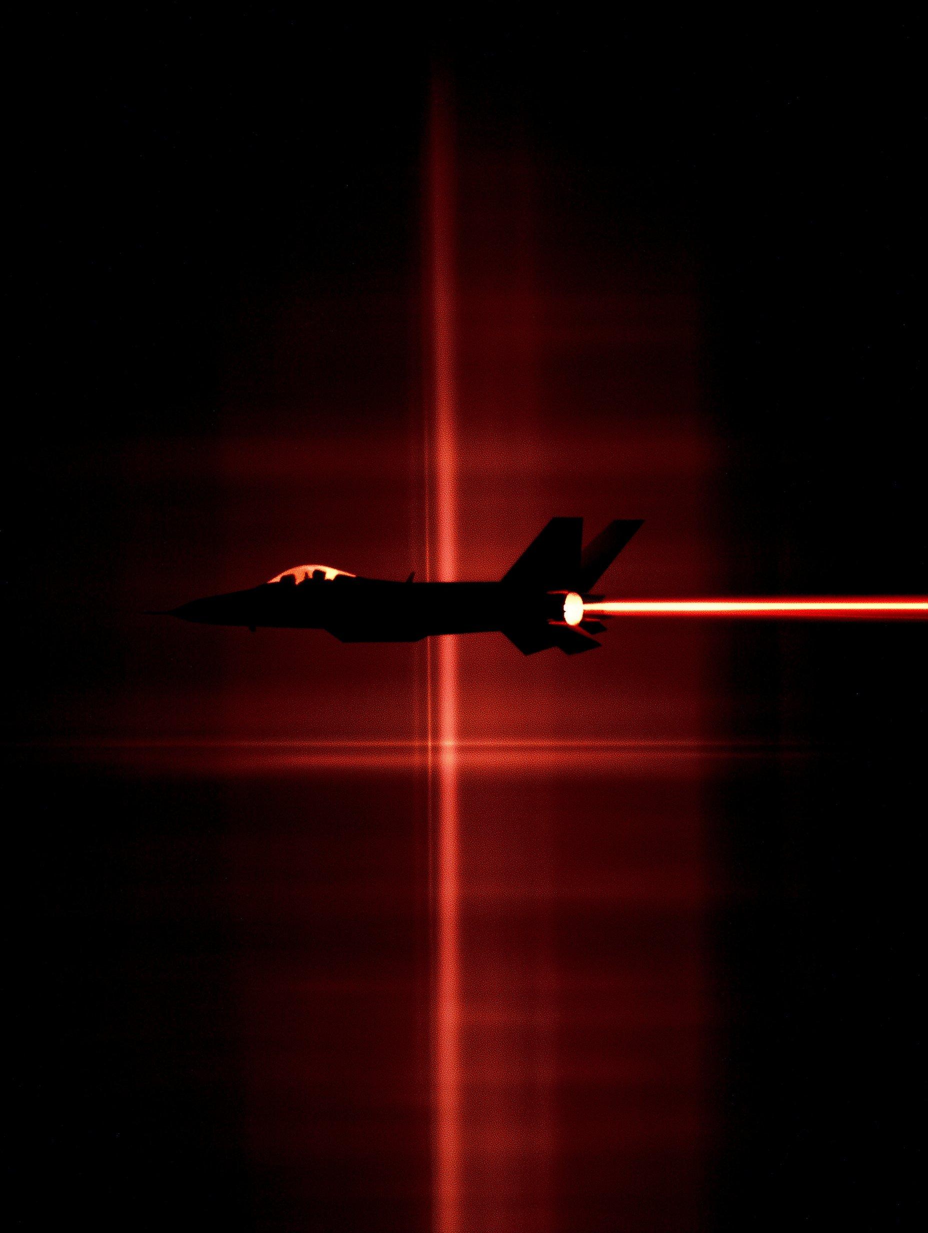Fighter jet with bright orange afterburner