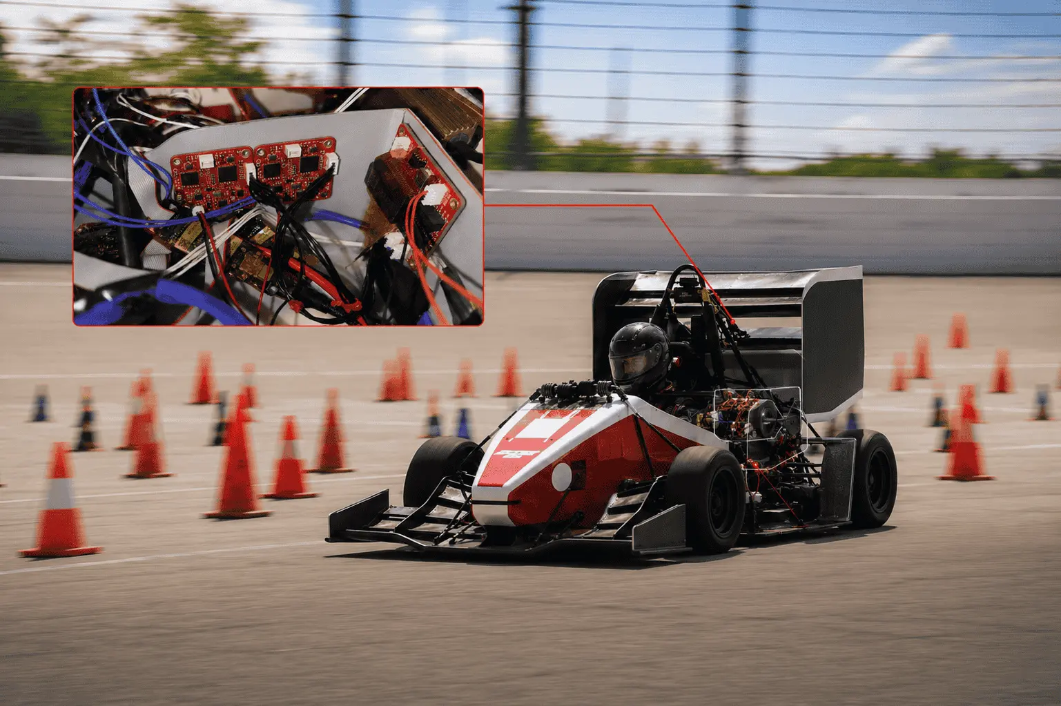 MIT Motorsports Formula SAE car on track with a detail view of the BotBlox boards integrated in its electronics bay