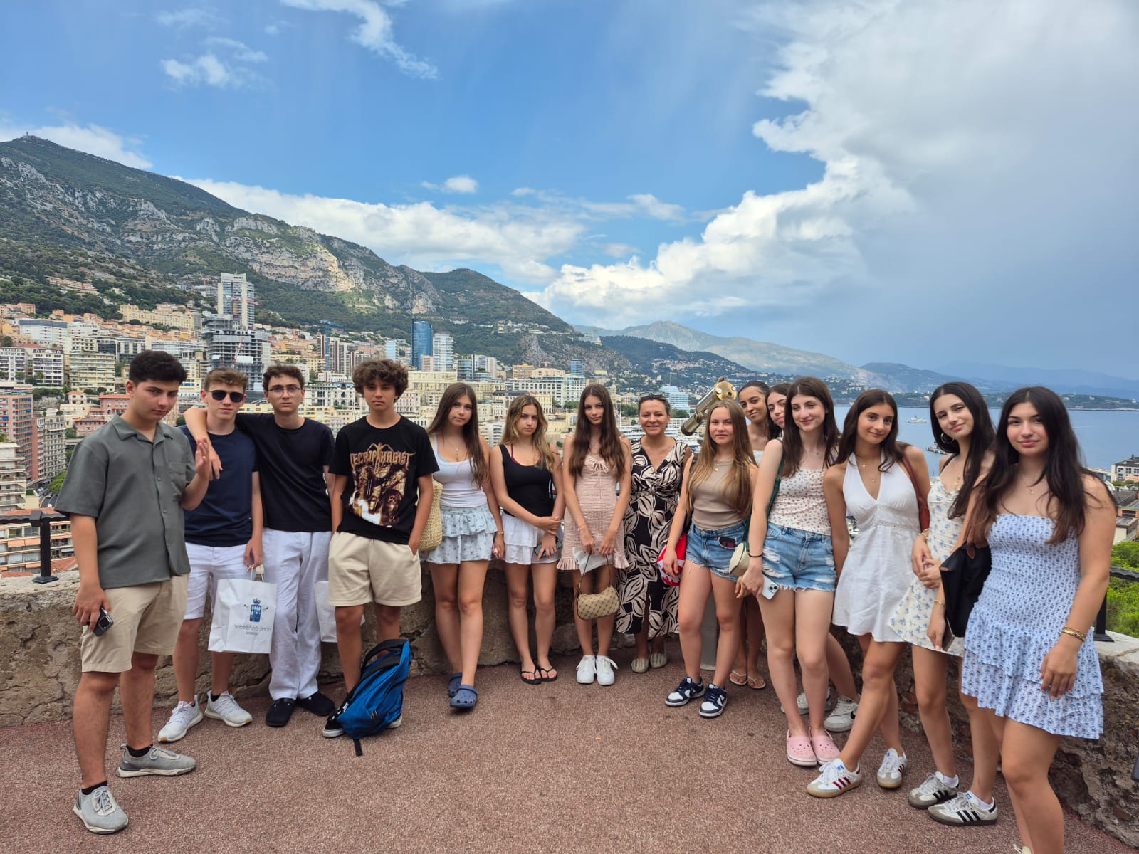 woman carrying white and green textbook
