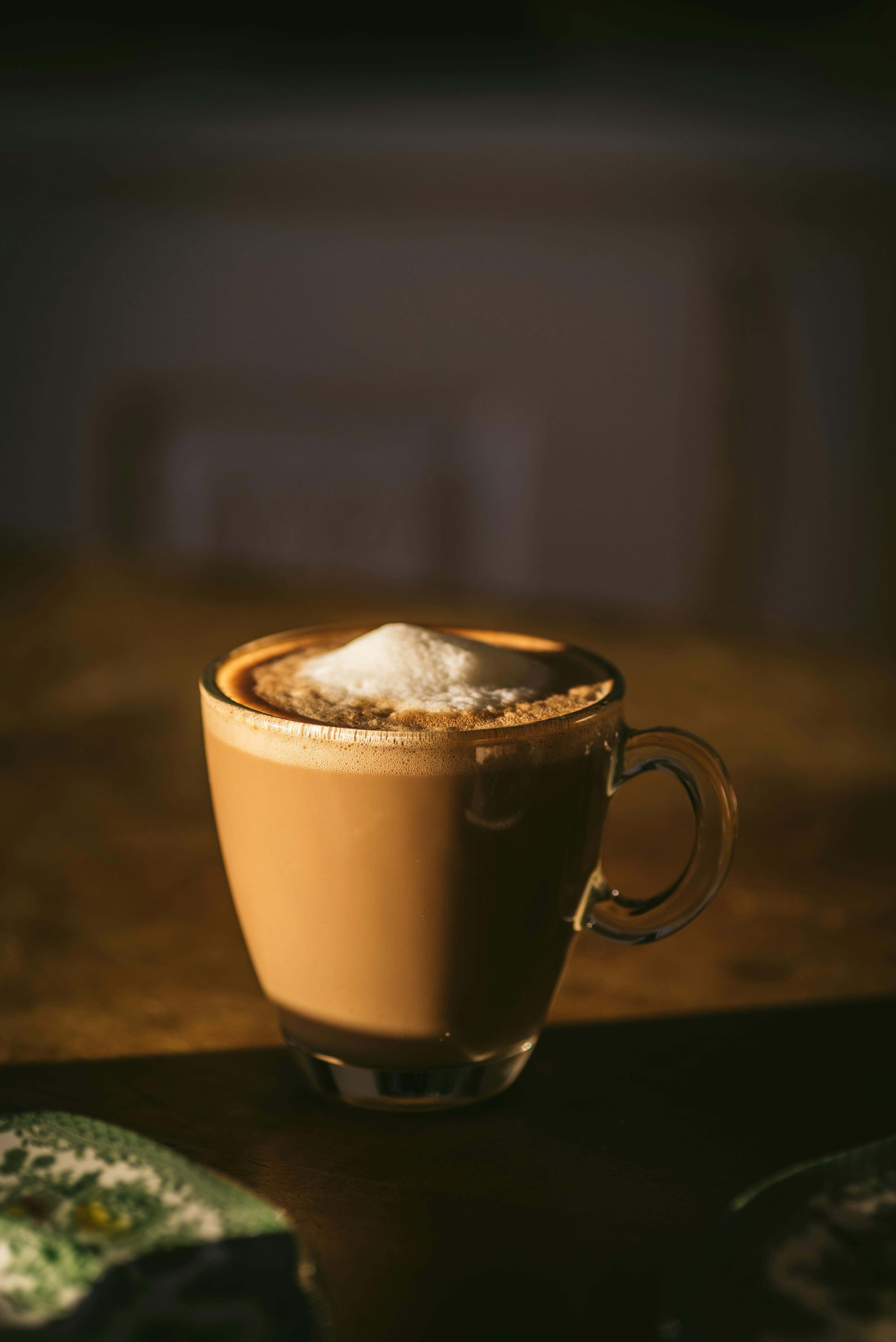 A cappucino in a glass mug