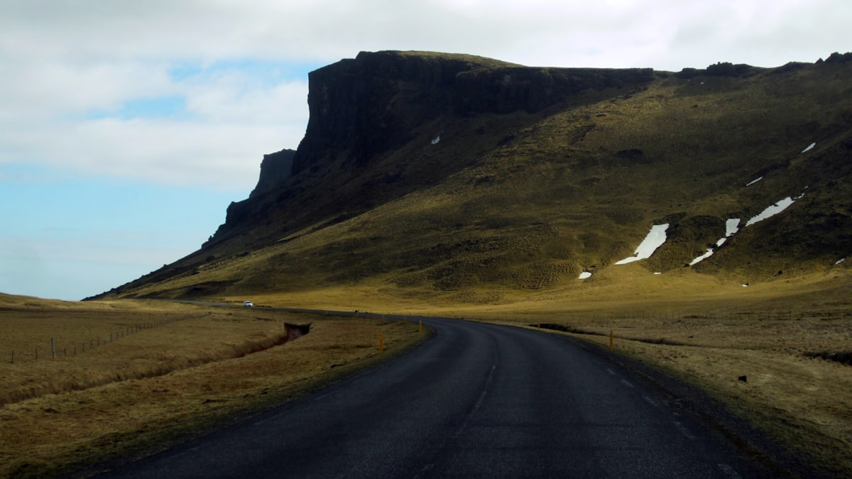 iceland transportation long highland road with distant mountain