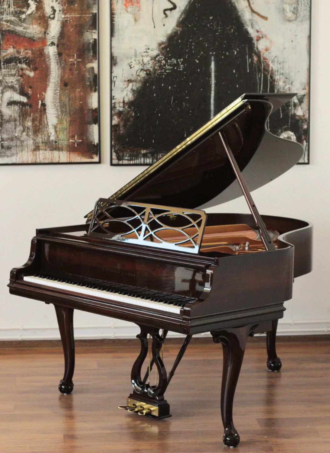 Magnificent Steinway & Sons Louis XV grand piano in rosewood with elegant curves and ornate details, restored by Meyer Pianos.