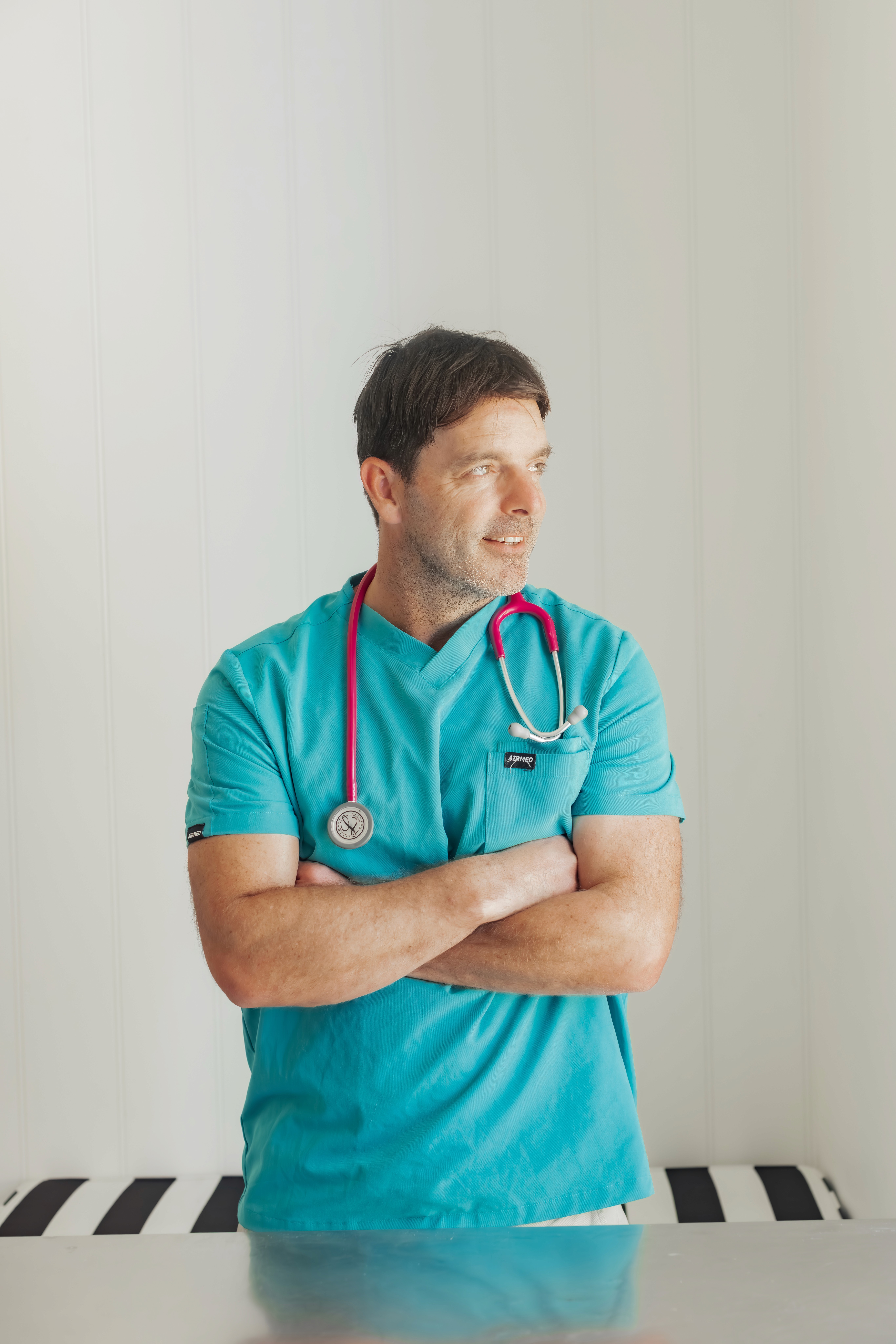 Vet with arms folded