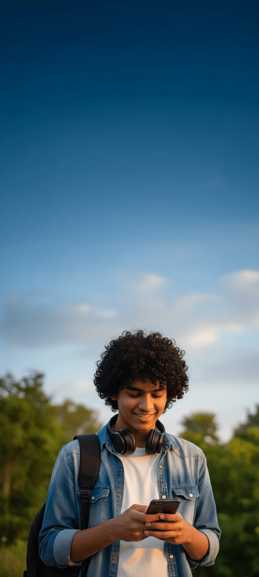 A Hindu Undivided Family sitting together in a living room enjoying snacks.