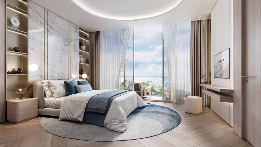 A modern bedroom featuring a large bed and expansive window, showcasing a sunset view over Dubai's bay.