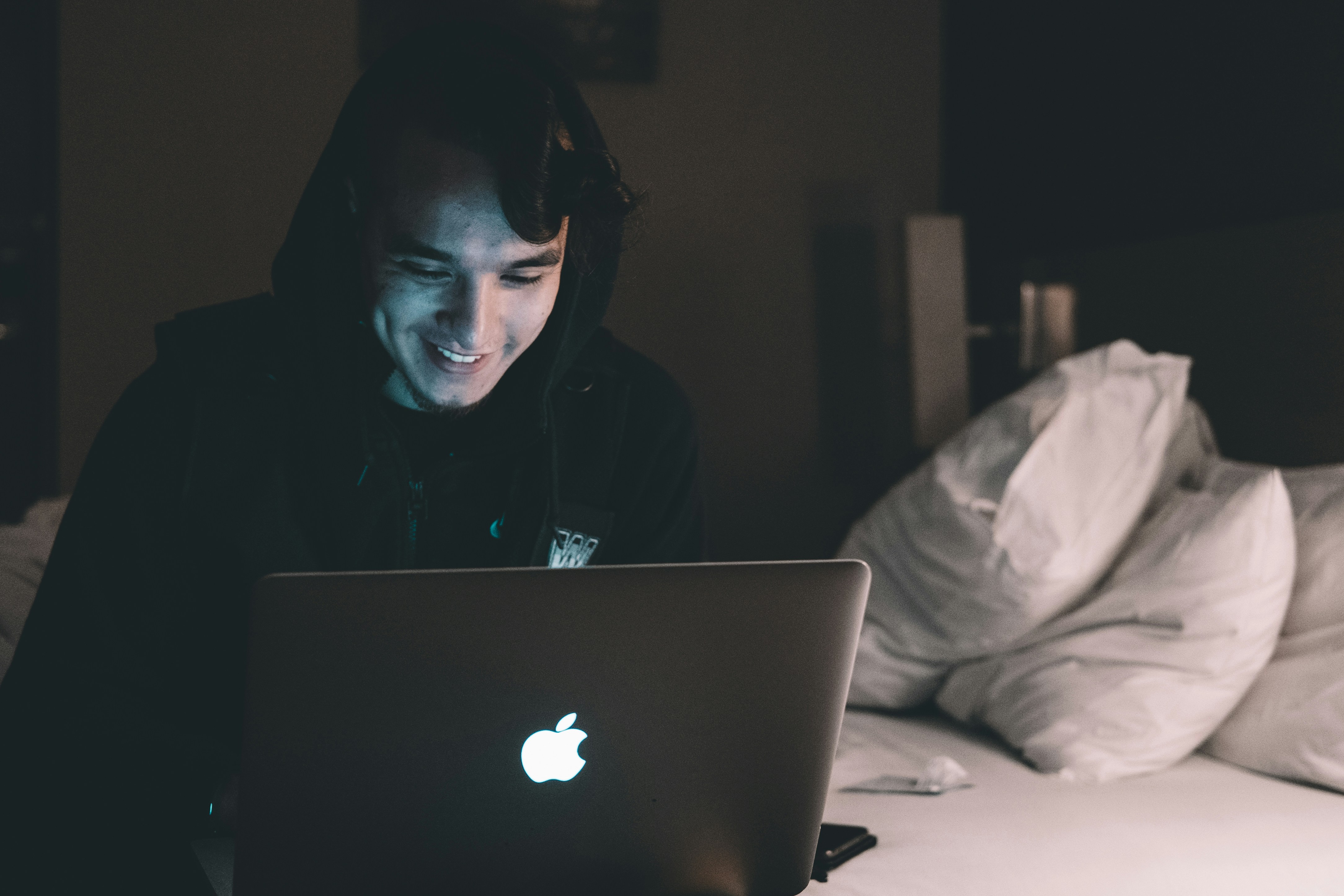 person in bed working on Formula For A Thesis Statement 