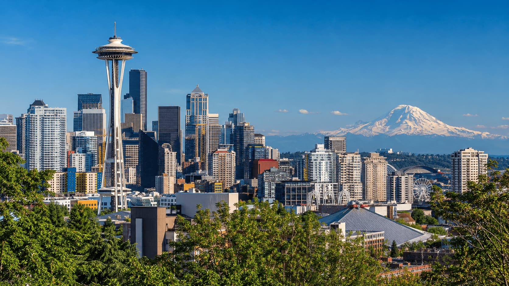 Seattle skyline with Space Needle and mountain background