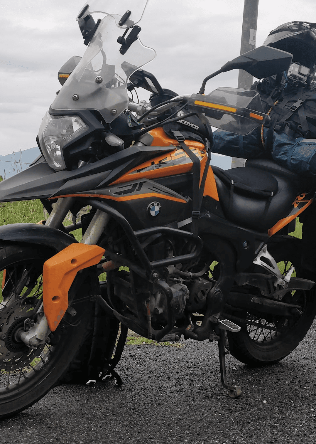 A person sitting on the floor with a book and a cup of coffee