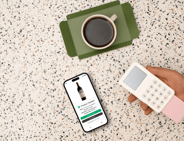 a cellphone leaning against a wall