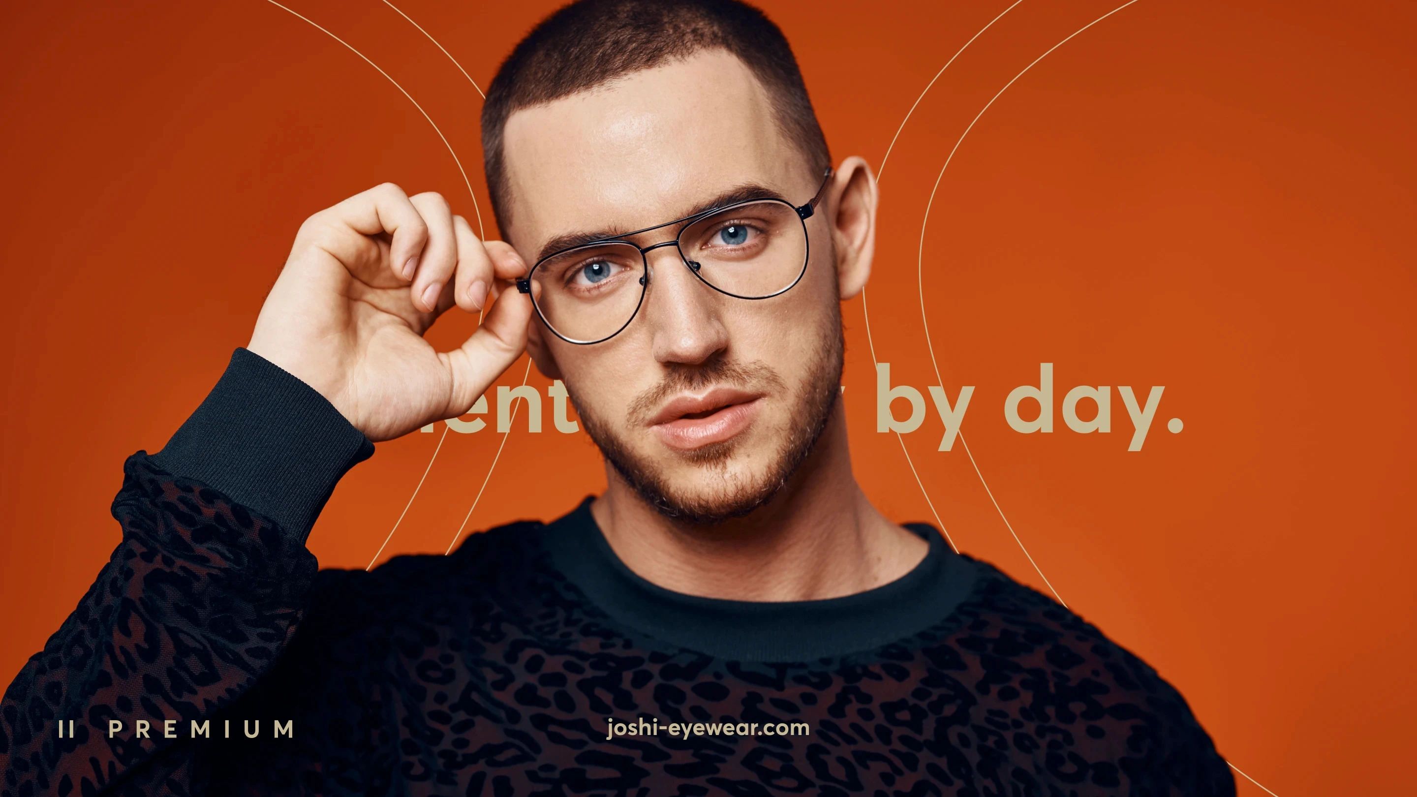 Man wearing glasses and dark sweater