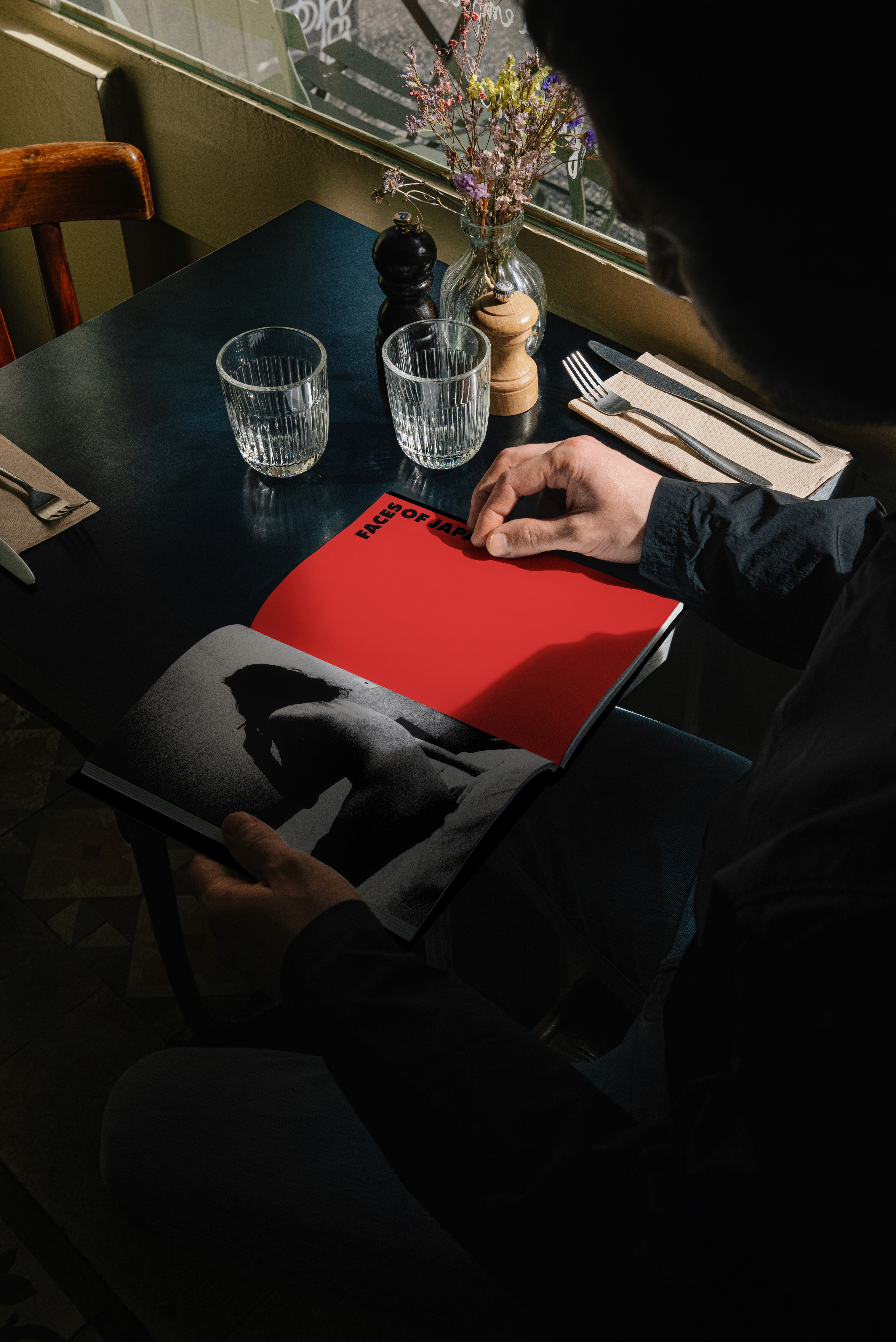 Minimalist book cover on white stairs with clean editorial design